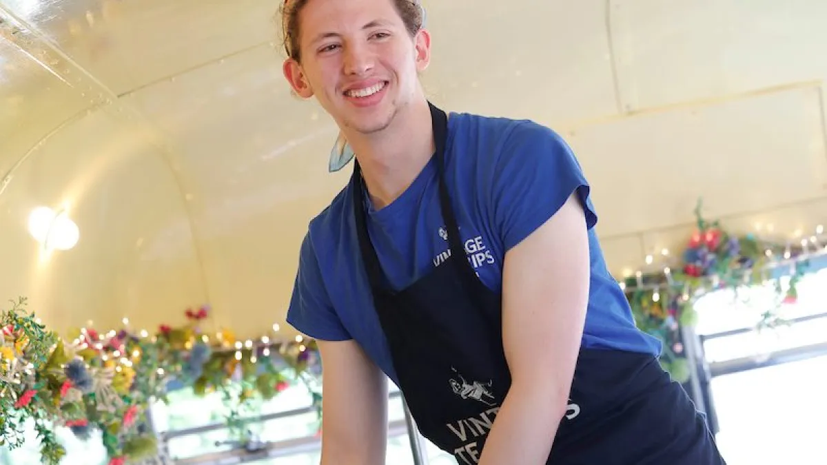 a person standing in front of a table