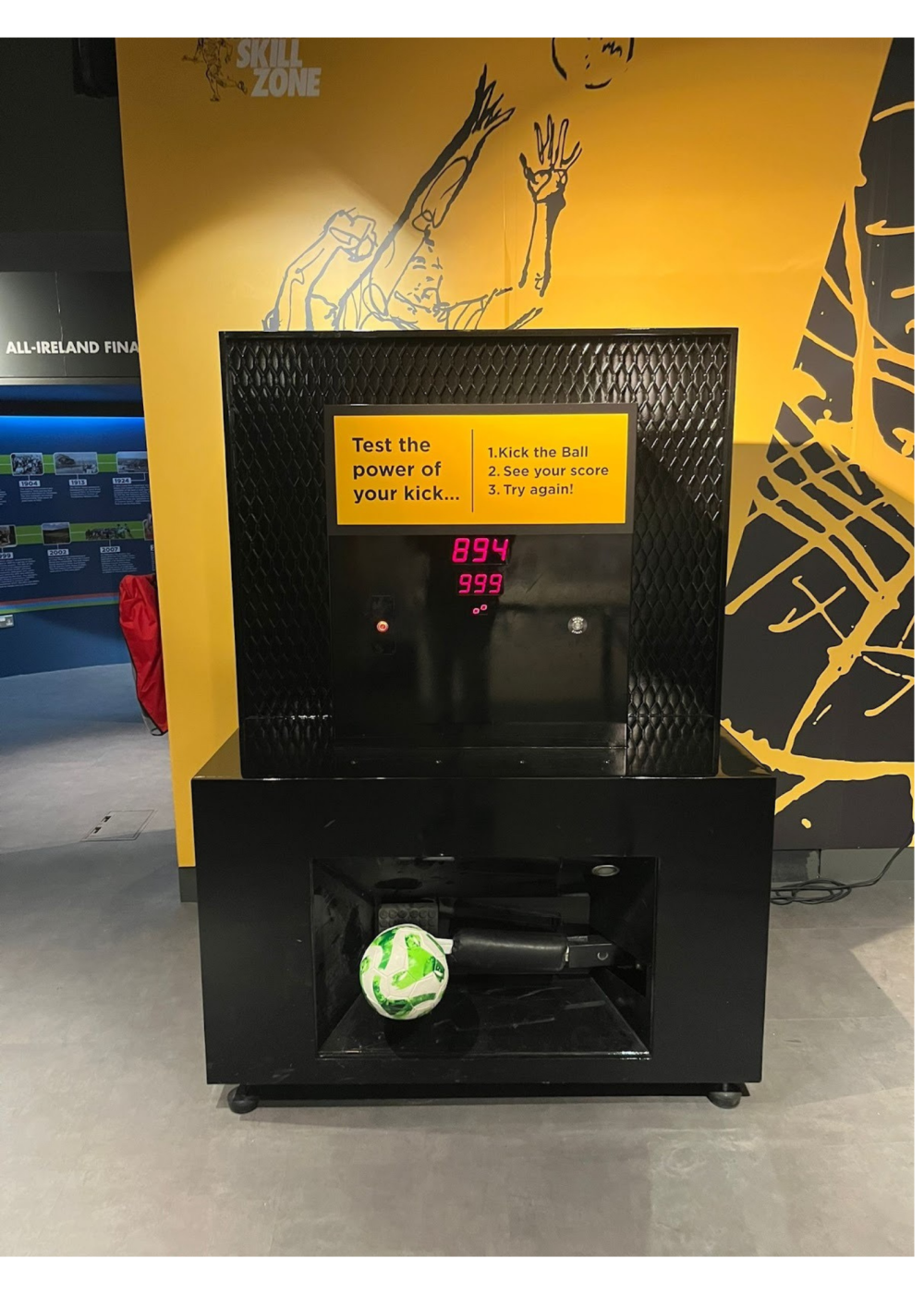 Kick strength measuring booth with score display and instructions.
