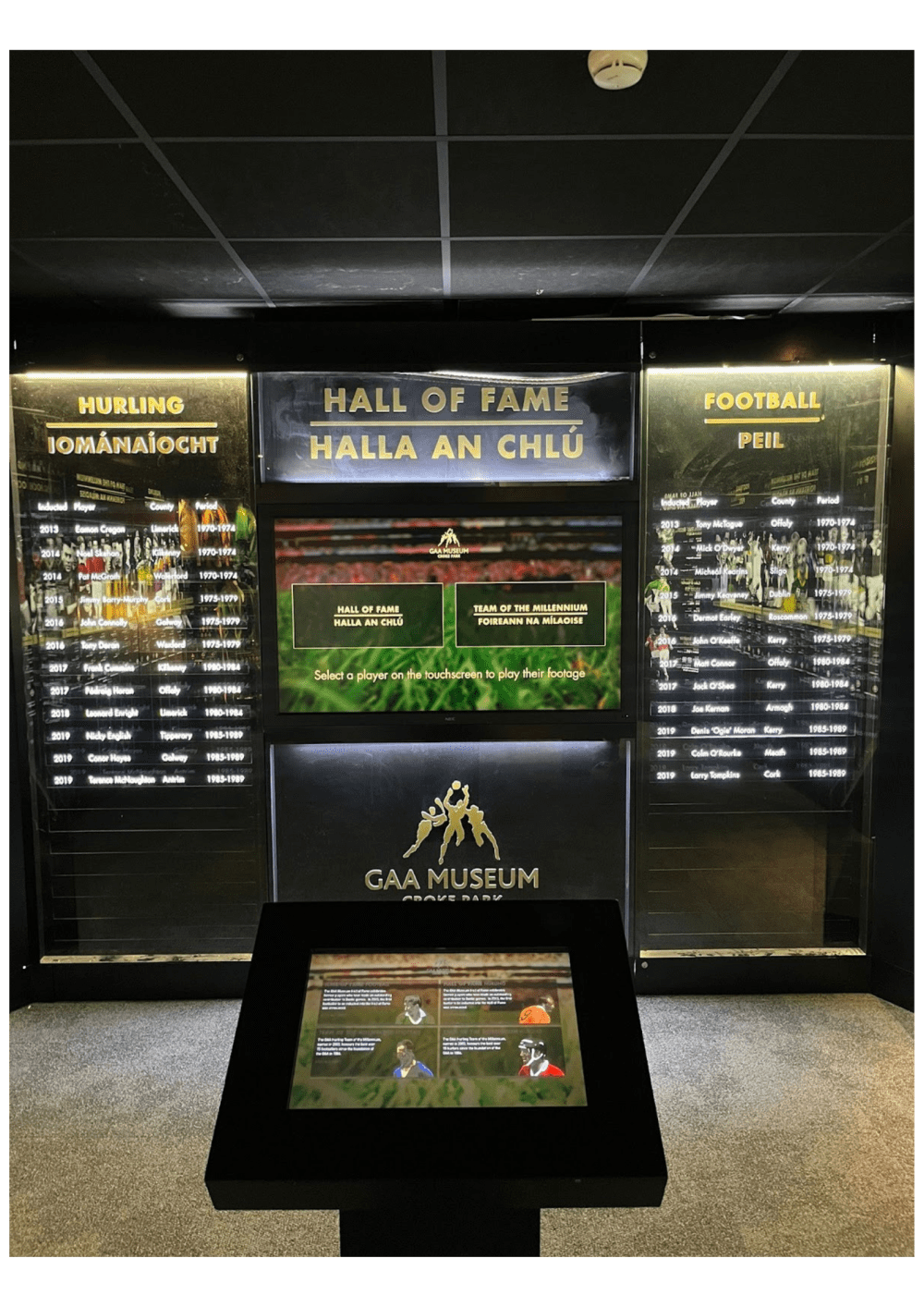 GAA Museum Hall of Fame display for hurling and football with a digital screen and information panels.