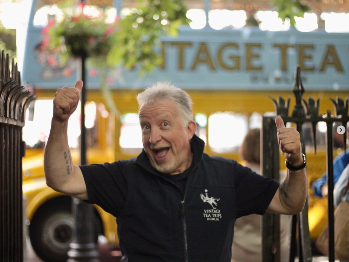 Man giving two thumbs up wearing a black Vintage Tea Trips branded gilet
