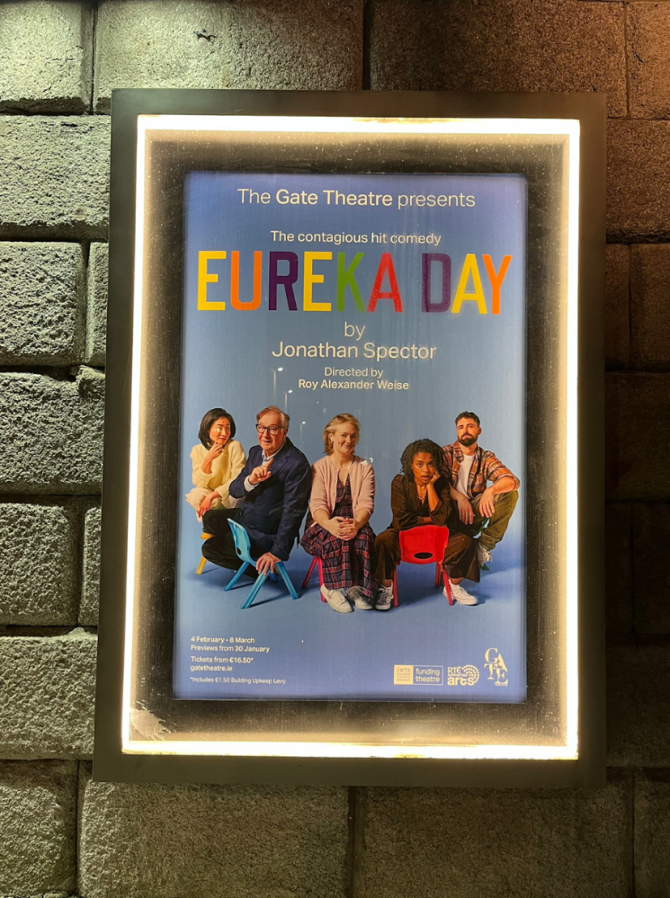 Poster for 'Eureka Day' play by Jonathan Spector, showing five seated people.