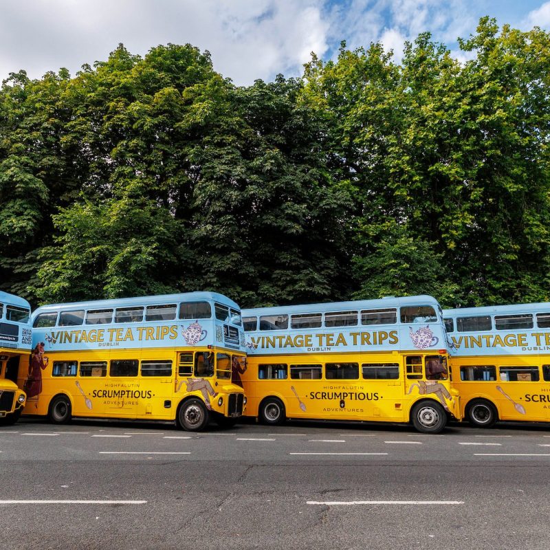 Four vintage tea trips double-decker buses parked at stephens green
